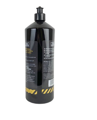 Black bottle with a label on a white background