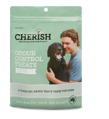Pack of Cherish Odour Control Treats for dogs with a man holding a dog on a white background