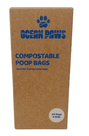 Box of Ocean Paws compostable poop bags with a brown cardboard box and blue text.