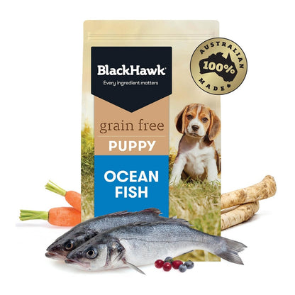 A bag of BLACKHAWK K9 PUPPY GRAIN FREE FISH, featuring an image of a dog and fish on the front, with carrots and a blueberry on the side.